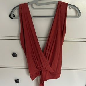 Rust color lulus cross tie body suit.